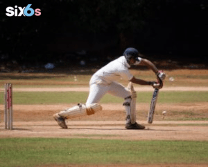 batsman playing with a bat and a ball