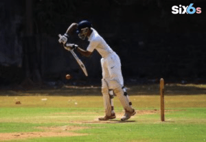 batsman playing with a bat and a ball