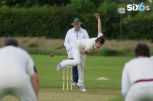 a bowler delivering the ball to the batsman in a cricket exchange match